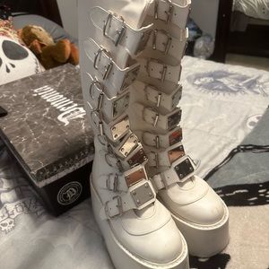 Selling white buckled demonias for 107